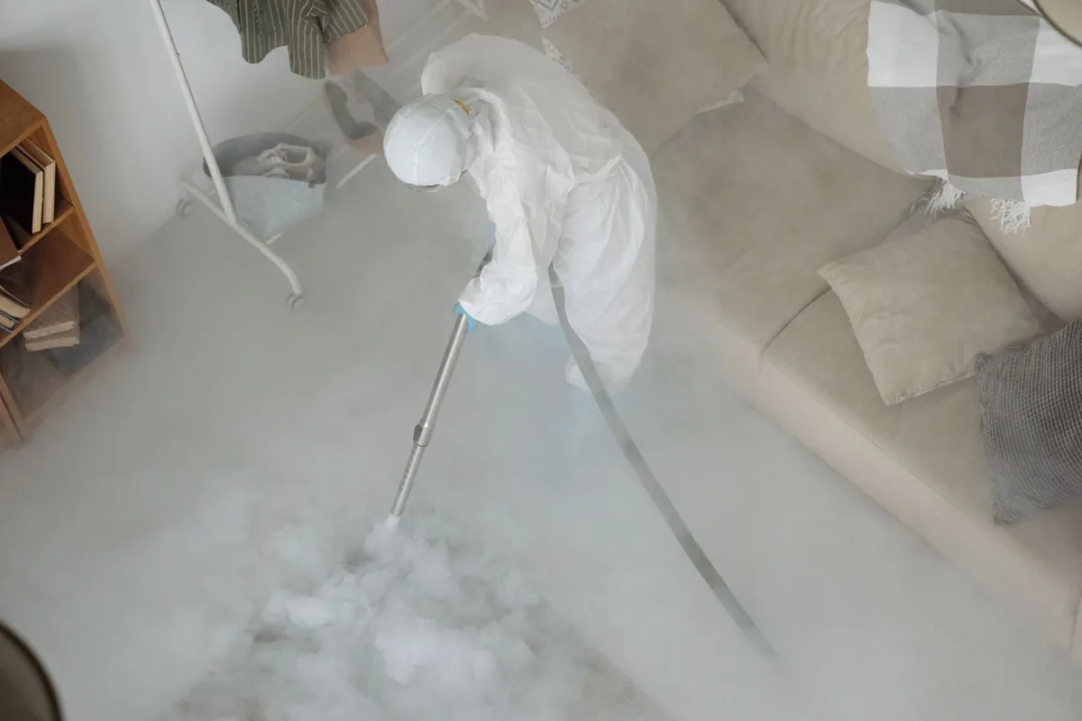 Biohazard cleanup technician in protective equipment, Seaside, CA